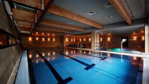 a large swimming pool in a building at VacationClub – Seaside Park Apartament 316 in Kołobrzeg