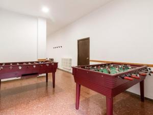 two foosball tables in an empty room at Vielha Centro Estudio in Vielha
