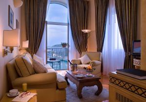 a living room with a couch and a table at Miramare E Castello in Ischia