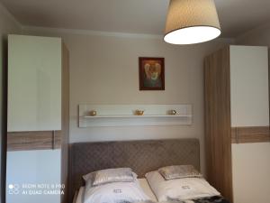 Posteľ alebo postele v izbe v ubytovaní Apartament Krokus SPA + 15 fotografií