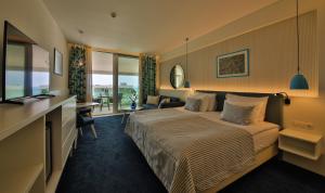 White Lagoon Resort - All Inclusive tesisinde bir odada yatak veya yataklar