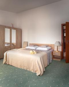 Posteľ alebo postele v izbe v ubytovaní Pionier