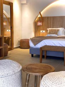 Ένα ή περισσότερα κρεβάτια σε δωμάτιο στο Kokkinos Villas 
