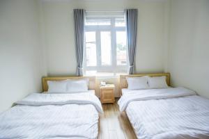 Postel nebo postele na pokoji v ubytování Sơn Liễu Homestay