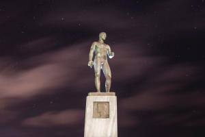 a statue of a man standing on top of a monument at Studio Cozy - In the Heart of Skyros Village in Skiros