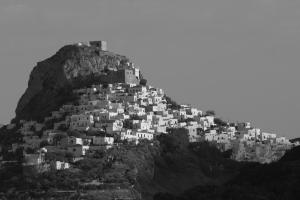 a group of white houses on a mountain at Studio Cozy - In the Heart of Skyros Village in Skiros