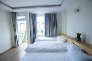 Postel nebo postele na pokoji v ubytování Sơn Liễu Homestay