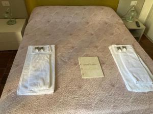 Postel nebo postele na pokoji v ubytování Borghetto Pedale