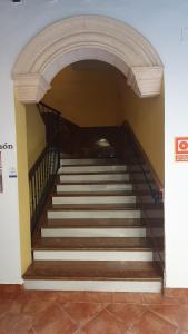 a staircase in a building with a stair case at Coso Viejo in Antequera
