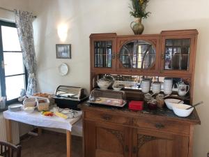 a kitchen with a buffet of food on a table at Penzion Rejštejn in RejÅ¡tejn