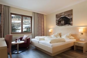 Postel nebo postele na pokoji v ubytování Family & Sporthotel Kärntnerhof + 37 fotografií