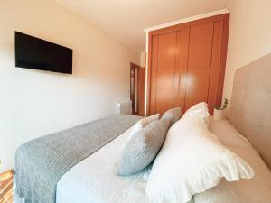 Łóżko lub łóżka w pokoju w obiekcie APARTAMENTO ANTOPA MAR