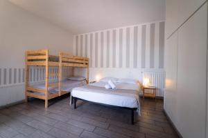 Postel nebo postele na pokoji v ubytování Villa Cinque Pini