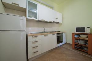 Kuchyň nebo kuchyňský kout v ubytování Residence Palazzo Gasparroni