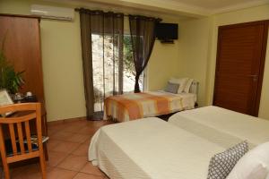 Postel nebo postele na pokoji v ubytování Hotel Rural Rocha da Gralheira