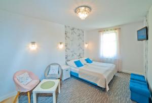 En eller flere senge i et værelse på Bolesława Chrobrego 34