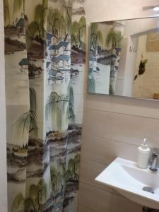 a bathroom with a sink and a mirror at La Casa Di Lo in Monopoli +19 photos