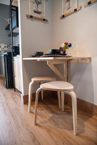 a table with two stools and a table with a table at Urban Sea View Lofts #2 in Chalkida +10 photos