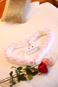 Voodi või voodid majutusasutuse Yihe Hotel Ouzhuang toas