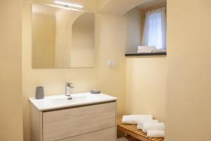 a bathroom with a sink and a mirror at PORTOVECCHIO in Levanto +50 photos