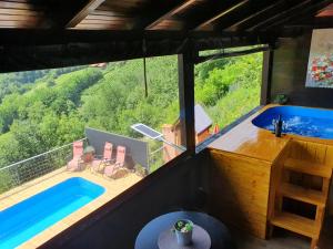 a villa with a swimming pool and a house at Hygge Hill in Krapinske Toplice