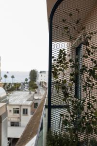 a window with a view of a city at Old Port Hotel in Limassol