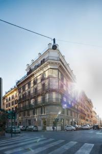 a large building on the corner of a street at Midnight in Rome Guest House in Rome