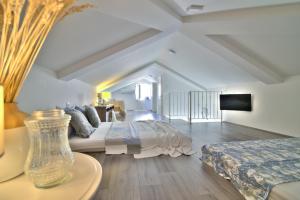 a large bedroom with a bed and a couch at Dida moj in Senj