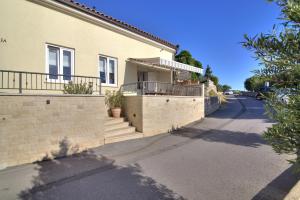 a house on the side of a street at Dida moj in Senj
