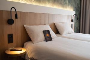 Ein Bett oder Betten in einem Zimmer der Unterkunft ibis Brussels Waterloo