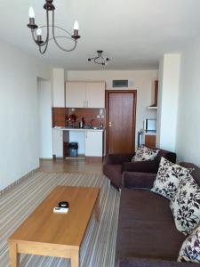 a living room with a couch and a coffee table at Villa Valeev in Sozopol