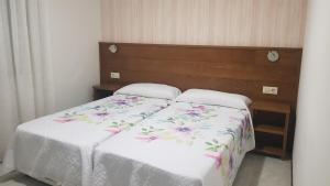 Łóżko lub łóżka w pokoju w obiekcie Casa Fuentes