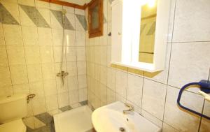 a bathroom with a toilet and a sink at Panos Cottage in Koinyra +33 photos