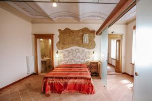 En eller flere senge i et værelse på Il Pozzo Fiorito