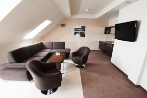 Telewizja i/lub zestaw kina domowego w obiekcie Hotel Gem
