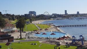 a park with a swimming pool next to a body of water at Gateway to the Surf Coast and Geelong in Geelong