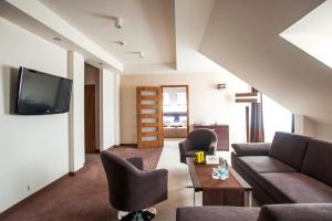 Telewizja i/lub zestaw kina domowego w obiekcie Hotel Gem