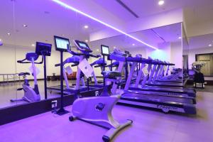 a gym with purple cardio machines in a gym at Lakeshore Hotel Hualien in Hualien City