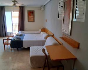 Postel nebo postele na pokoji v ubytování Hotel Alaska