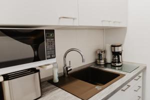 Kuchyň nebo kuchyňský kout v ubytování SK Apartments - Green