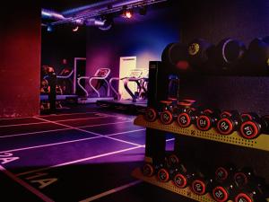 a room with a gym with lots of machines at Atlantic Suites Serviced Apartments in Gibraltar