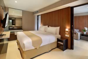 Letto o letti in una camera di Yuan Garden Pasar Baru