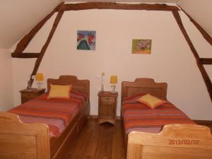 Кровать или кровати в номере Gite les Merlettes