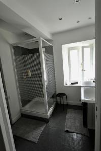 a bathroom with a shower with a glass door at Maison avec piscine et jardin- 4 chambres 8 pers in Cuers
