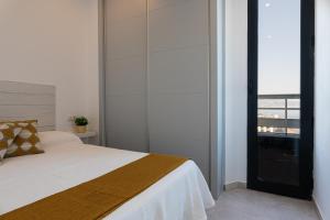 Posteľ alebo postele v izbe v ubytovaní Mar Infinito. Apartment with dream views