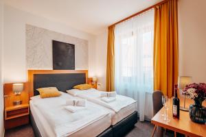 Posteľ alebo postele v izbe v ubytovaní Hotel Klika