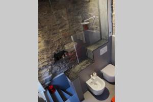 a bathroom with a sink and a toilet at Casa Oliva Cinque Terre in Manarola