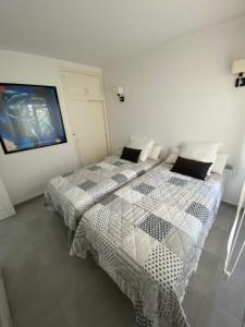 Posteľ alebo postele v izbe v ubytovaní Apartament El Far