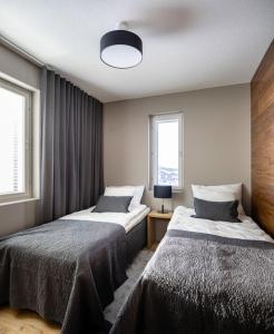 Postel nebo postele na pokoji v ubytování Levin Kunkku, Apartment B7