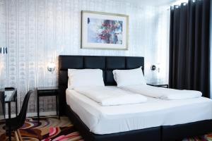 Cama ou camas em um quarto em A Hotels City